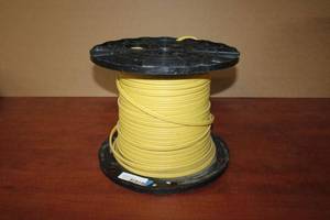 lot 141 image: Partial roll of 12-2 with ground Yellow wire on spool.  Originally 400 Ft. Estimate 200-250 ft. Please preview.