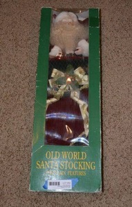 lot 94 image: Old World Santa Stocking with Porcelain Features Decoration