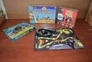 lot 201 image: Board Games Cariboo and High School Musical both Unopened, Sea World and Zathura