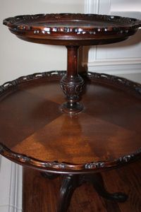 lot 12 image: 2-Tier Pedestal Table (Tag Marked Bekins 6-1-83)