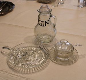 lot 31 image: Glass Servers SyrupGin Decanter, Sugar Serving Bowl with Glass Spoon, and Relish Tray with Glass Spoon