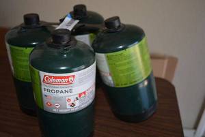 lot 123 image: Set of 4 Coleman Camping Propane Tanks