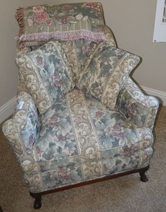 lot 110 image: Floral Design Upholstered Arm Chair with Throw and Pillows