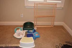 lot 87 image: Wire Pet Gate, Fisher Price Potty Seat (never used), Speedo Life Vest, Cooshee Booster Seat and Step LIKE NEW