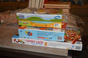 lot 89 image: Games Chutes and Ladders (unopened), Memory, Connect 4, and Candyland