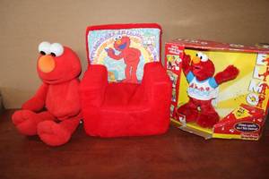 lot 195 image: Elmo Lot Plush Elmo, Toddler Cushion Elmo Chair and Fisher Price Elmo still in Box