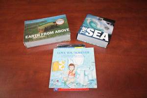 lot 178 image: BOOKS Earth From Above (Unopened), The Sea Cube Book, and Love You Forever