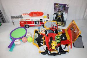 lot 180 image: Tonka Rescue Truck (batteries not included), Fold-Up Car Track, Batman Figurine and Paddles