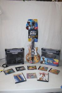 lot 210 image: Paper Jamz Amplifiers and Guitar, CDs and Movies as shown