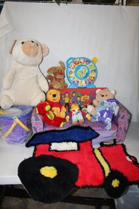 lot 218 image: Train Rug, The Wiggles SeatBed, Sand Bucket, Stuffed Animals and Animal Sounds Toy