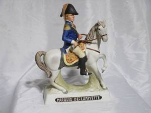 lot 86 image: 1977 PORCELAIN GRANADIER DECANTER, MARQUISE DE LAFAYETTE, HAT WITH CORK HAS BROKEN CORK, HAS TAX STAMP STILL ATTACHED