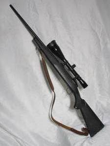 lot 2 image: SAVAGE ARMS 110 RIFLE CHAMBERED IN 30-06 SPRG.INCL SCOPE AND LEATHER STRAP W 2 DEER ON MNTN SCENE