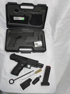 lot 122 image: JHP .45 CALIBER HI-POINT HANDGUN. INCLUDES CLEANING BRUSH, XTRA MAG, CANIK SPEED LOADER, CHANGABLE BACKSTRAP, STORAGE CASE