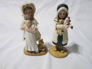 lot 299 image: 2 JAN HAGARA LIMITED EDITION PORCELAIN FIGURINES, 5016 (FADED AND HARD TO READ) 1982 JENNY AND HER BYE-LO DOLL, NOEL 1987 NUMBERED 489