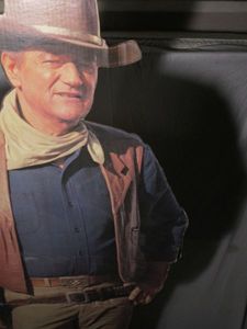 lot 149 image: TALL JOHN WAYNE CARDBOARD CUTOUT AND COLLECTOR KNIVES