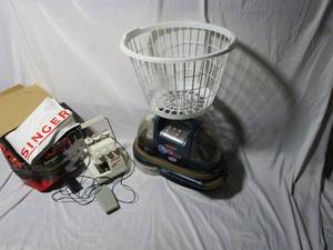 lot 283 image: SINGER TINY SERGER SEWING MACHINE, BISSELL SPOT BOT VACCUUM, LAUNDRY BASKET