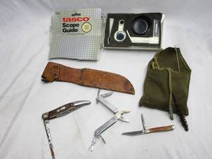 lot 94 image: TASCO SCOPE GUIDE TO ZERO RIFLE SCOPE, VINTAGE BORE CLEANER, VINTAGE LEATHER KNIFE SHEATH, 2 VINTAGE POCKET KNIVES, 1 ALL IN ONE TOOL