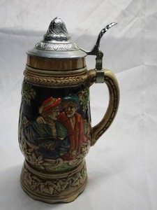 lot 343 image: HANDCRAFTED CERAMIC STEIN WITH MUSIC WIND KNOB ON BOTTOM , JAPAN.