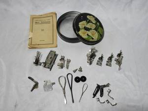 lot 108 image: GENEROUS LOT OF SEWING MACHINE ATTACHMENTS FROM SINGER, SIMANCO, GREISE &amp COMPLETE INCLUDING MULTIPLE SIZE HEMMERS