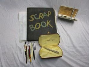 lot 379 image: VINTAGE SCRAP BOOKS FILLED WITH VINTAGE SHOW TICKETS AND CLIPPINGS FROM THE 1930S AND MORE. VINTAGE PENS.1951 PARKER 51 PEN IN ORIGINAL CAE. ASTRO POINT PEN IN A SMOKY GUNMETAL FINISH IN ORIGINAL CASE WITH ORIGINAL GUARANTEE.&nbsp