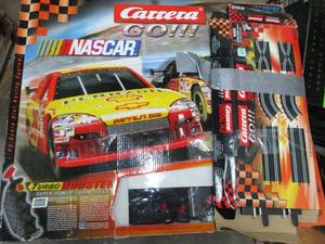 lot 388 image: NASCAR SLOT CAR RACING TRACK IN BOX.