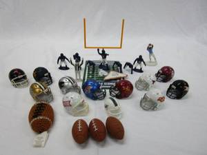 lot 368 image: COLLECTIBLE FOOTBALL MINI HELMETS AND FOOTBALLS. HORNED FROGS FLICK FIELDGOAL GAME WITH FLICK FOOTBALLS AND PLAYER FIGUERINES.