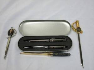 lot 374 image: PRESIDENTIAL LOT.... JIMMY CARTER LIBRARY METAL LETTER OPENER, TRUMAN PRESIDENTIAL MUSEUM &amp LIBRARY PEN SET IN CASE, HERBERT HOOVER METAL LETTER OPENER, SWORD STYLE METAL LETTER OPENER WITH THE STATE SEAL OF TEXAS.&nbsp