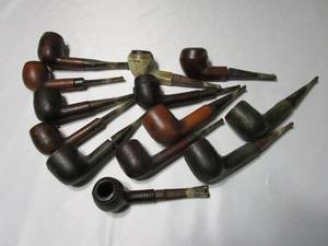 lot 366 image: LOT OF VINTAGE PIPES. MADE WITH LEATHER CASINGS STAMPED LONGCHAMP FRANCE .