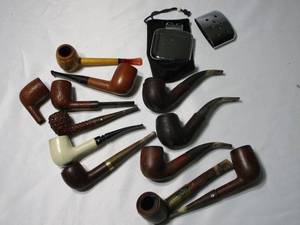 lot 369 image: LOT OF VINTAGE PIPES, SOME WITH LEATHER CASINGS WITH GRAND PRIX ITALY STAMP LONGCHAMP FRANCE STAMP, IMPORTED BRIAR, ONE HAS BAND THAT STATES 14K SOLID GOLD...KAYWOODIE NATURAL BURL...GOLDEN PARKER MADE IN LONDON...&nbsp &nbspZIPPO OUTDOOR HAND WARMER