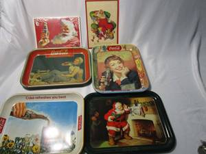 lot 394 image: VINTAGE COCA COLA TIN TRAYS, VINTAGE HALLMARK COCA COLA CHRISTMAS CARD, 1992 COCA COLA SMALL POSTERS STILL IN PACKAGING, METAL COCA COLA BOTTLE OPENER.