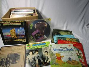 lot 397 image: LARGE LOT OF RECORDS INCL 1974 GRATEFUL DEAD FROM THE MARS HOTEL, 1970 GRATEFUL DEAD WORKINGMANS DEAD, E.T. COLLECTORS EDITION SOUNDTRACK, UNOPENED, STAR TREK COMIC ON RECORD, DISNEY READ ALONG RECORDS, DINO PLAYS CLASSIC COUNTRY SIGNED &amp MANY MORE