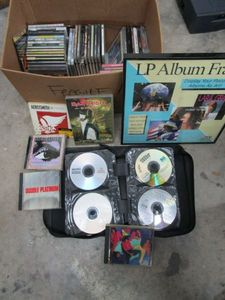 lot 417 image: GENEROUS LOT OF CDS...ROLLING STONES, IRON MAIDEN, MANY MORE.. RECORD ALBUM DISPLAY FRAME, CD DISC HOLDER.