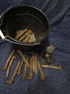 lot 156 image: BUCKET OF GENUINE RAILROAD SKIKES