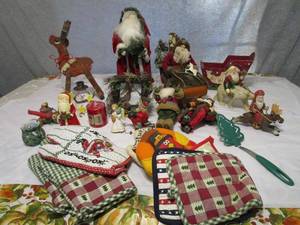 lot 163 image: HOLIDAY DECOR, UNIQUE WOOD CARVED SANTAS, SLEIGHS, OVEN MITS, CANDLES, RUDOLPH &amp MORE