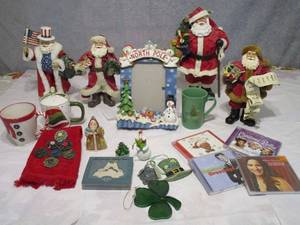 lot 172 image: XMAS DECOR, FABRECHE (FABRIC MACHE) SANTAS, ONE IS A MUSICAL PATRIOTIC SANTA, CHECKING HIS LIST SANTA, CLOTHIQUE POSSIBLE DREAMS SANTA, LENOX XMAS TREE ORNAMENT, HOT COCOA MUGS, PICTURE FRAME, ST PATRICKS DAY ITEMS