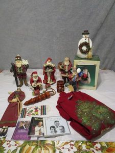 lot 175 image: CLOTHTIQUE IMPOSSIBLE DREAMS SANTAS, FABRIC MACHE SANTA, PATRIOTIC SANTA, XMAS CDs, KEEPSAKE SNOWMAN ORNAMENT,MXMAS SWEATER, ANGEL