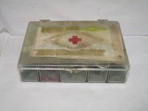 lot 231 image: VINTAGE FIRST AIDE KIT W VINTAGE COCA-COLA SYRUP
