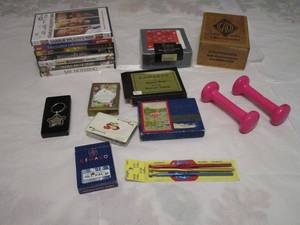 lot 317 image: VINTAGE CARD SETS, SMALL DUMBELLS, DVDS, CANASTA CARD SET, VINTAGE CIGAR BOX, KNITTING TOOLS NIB, RED PAISLEY NAPKINS NIB