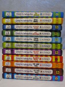 lot 329 image: DIARY OF A WIMPY KID BOOKS