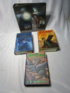lot 526 image: HARRY POTTER LOT...FIRST EDITION BOOKS HARRY POTTER AND THE DEATHLY HOLLOWS, HARRY POTTER AND THE PRISONER OF AZKABAN, HARRY POTTER AND THE ORDER OF THE PHEONIX. HARRY POTTER COLLECTORS ALBUM