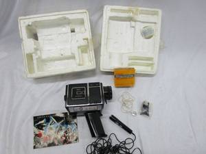 lot 527 image: VINTAGE SEARS SOUND VIDEO CAMERA. COMES WITH VINTAGE MICROPHONE, EARPIECE, VINTAGE KODAKEKTACHROME 160 SOUND COLOR MOVIE FILM, AND ORGINIAL MANUAL. STILL IN ORIGINAL FOAM PACKAGING.&nbsp