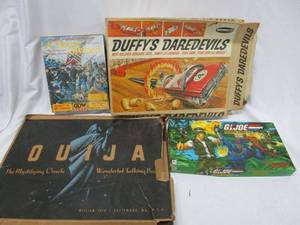 lot 528 image: VINTAGE BOARD GAME LOT...OUIJA BOARD IN ORIGINAL BOX, G.I.JOE MISSION COBRA H.G. GAMEBY MILTON BRADLEY IN ORIGINAL BOX, REMCO DUFFYS DAREDEVILS GAME IN ORIGINAL BOX, 1994 GDW GAMRE A HOUSE DIVIDED STRATEGIC AMERICAN CIVIL WAR GAME IN ORIGINAL BOX.