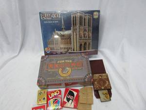 lot 537 image: UNO CARDS GAEMS, VINTAGE PLAYING CARDS NEW STILL WRAPPED, VINTAGE WOODEN BASEBALL PEG GAME, FOR THE RECORD ROCK N ROLL GAME IN ORIGINAL BOX, 3D PUZZLE OF NOTRE-DAME DE PARIS NEW UNOPENED IN ORIGINAL BOX.
