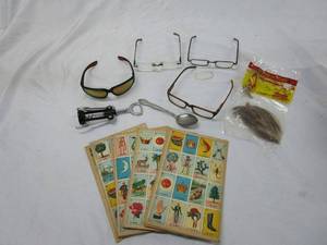 lot 546 image: VINTAGE GAME PIECES, SMITH &amp WESSON SUNGLASSES, INDIAN LORE, EYE GLASSES, CORKSCREW, SPOON.&nbsp