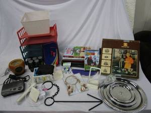 lot 607 image: DREAM CATCHER, IT WORKS PRODUTS, CONTOUR GLUCOSE MONITORING SYSTEM, DVD, KIDS BOOKS, ROLODEX, TIERED SERVING TRAY.