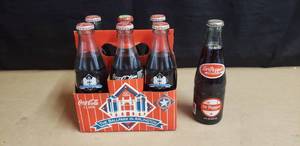 lot 15 image: 6 Pack of Commemorative 1994 Texas Rangers Ballpark Coca Cola Bottles Plus 1 Commemorative 1994 Texas Rangers Ballpark Dr Pepper Bottle