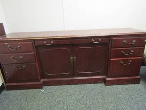 lot 201 image: Office credenza with drawers and double door bottom storage 29x76x19 in great shape ( some minor scratches)