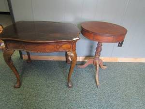 lot 207 image: Oval claw foot side table27x20 and end table with fish design on side 25x32