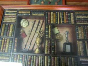 lot 213 image: Three 9x7 golf shadow boxes 20x13 golf book shadow box, and wooden golf carving 16x6