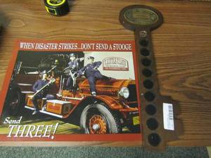 lot 231 image: The Three stooges metal sign 16x12 and 19 wooden key wall art